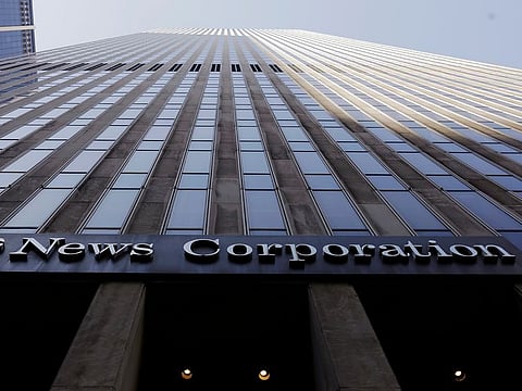The News Corporation logo is displayed on the side of a building in midtown Manhattan in New York.  