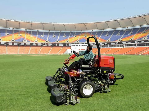 A groundsman works at the Sardar Patel Stadium, ahead of the third Test match between India and England, in Motera on the outskirts of Ahmedabad. 