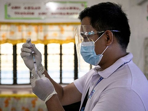 A health worker participates in a simulation for COVID-19 vaccination in preparation for its arrival in Pasig City.