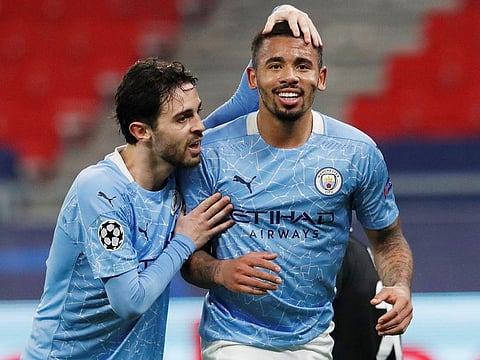 Manchester City's Gabriel Jesus celebrates scoring their second goal with Bernardo Silva.