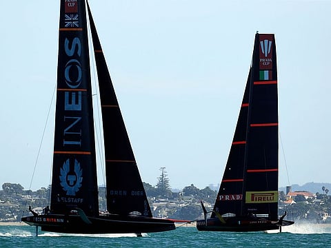 INEOS Team UK (L) competes against Luna Rossa Prada Pirelli on day one, race one of the final of the Prada Cup 2021, the  challengers series of the 36th America's Cup in Auckland on February 13, 2021.