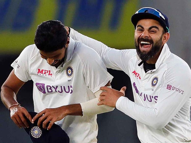 India's Washington Sundar and Virat Kohli celebrate the dismissal of England's James Anderson during the 2nd day of the 3rd Test Match in the series between India and England at Narendra Modi Stadium, Motera in Ahmedabad on Thursday. 