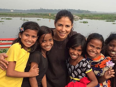 Maria Conceicao with slum children from Bangladesh