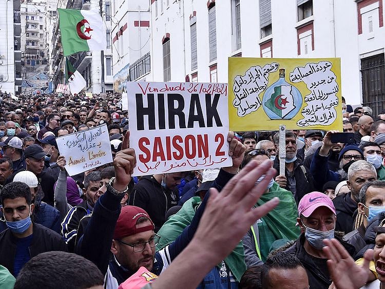 Algerian anti-government protesters take part in a demonstration in the capital Algiers, on February 26, 2021. 