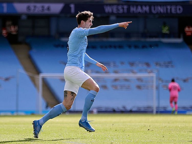 John Stones celebrates the winner for Manchester City against West Ham