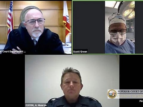 This zoom video conference collage captured by The Sacramento Bee, shows Dr. Scott Green who appeared Thursday, February 25, 2021, for his Sacramento Superior Court trial, held virtually because of the coronavirus pandemic, from an operating room in Sacramento, California.  