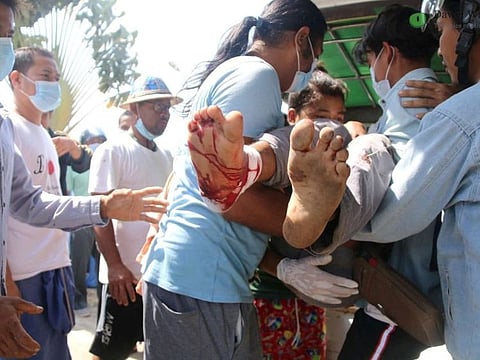 A wounded protester is carried amid protests against the military coup in Dawei, Myanmar February 28, 2021 in this picture obtained from social media.