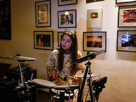 Dananeer Mobeen, 19, a social media influencer who has become famous after her five-second video went viral, plays the drums during an interview in Karachi, Pakistan February 27, 2021. 