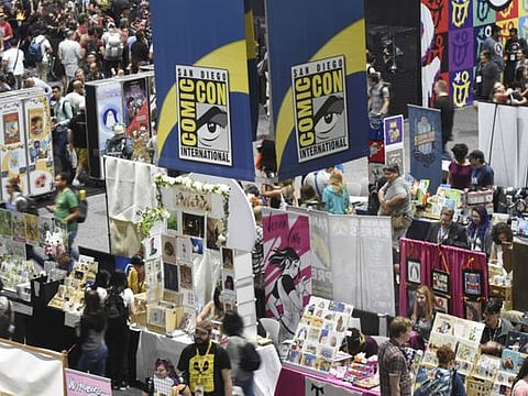 Comic-Con attendees walk the convention center floor during preview night at Comic-Con International on July 17, 2019, in San Diego, California.