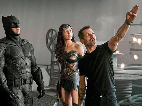 Ben Affleck, Gal Gadot and Zack Snyder on the set of the film.