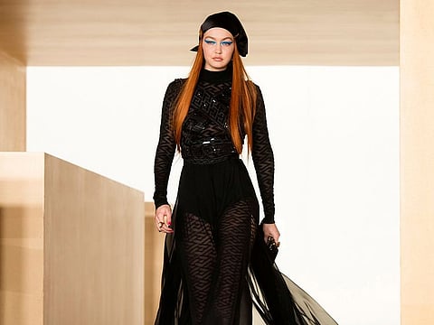 Model Gigi Hadid presents a creation from the Versace Fall/Winter 2021/2022 collection at the Milan Fashion Week, in Milan. 