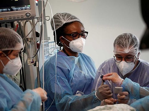 Medical staff work in the Intensive Care Unit (ICU) where patients suffering from the coronavirus disease (COVID-19) are treated at the Melun-Senart hospital, near Paris, France, March 8, 2021. 