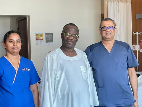Al Haji Buhari Bala, kidney cancer patient with Dr Sanjay Bhat and a nurse.