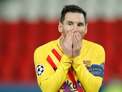 Barcelona's Lionel Messi reacts after missing a penalty against PSG.