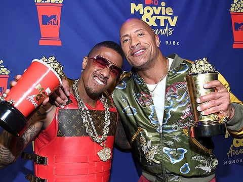Nick Cannon and Dwayne Johnson in a file photo from the MTV Movie and TV Awards