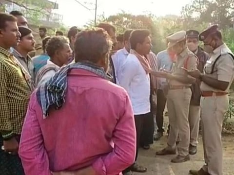Policemen at the accident scene.