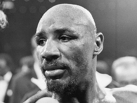 In this August 1974 file photo, Marvin Hagler stands in the ring after his boxing bout against Sugar Ray Seales in Boston.  