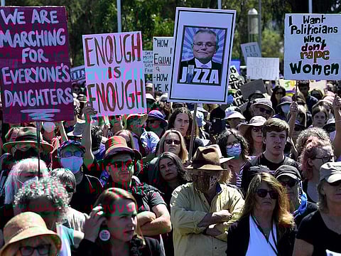 Protesters attend a rally against sexual violence and gender inequality in Australia's capital city Canberra on March 15, 2021. 