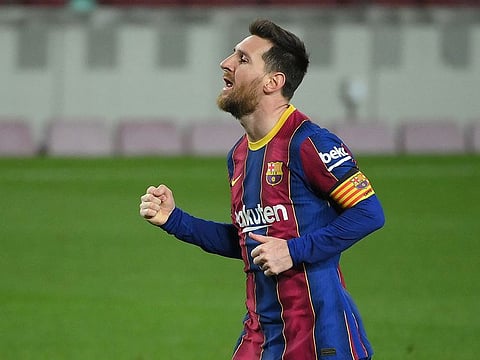 Lionel Messi celebrates after scoring Barcelona's fourth.