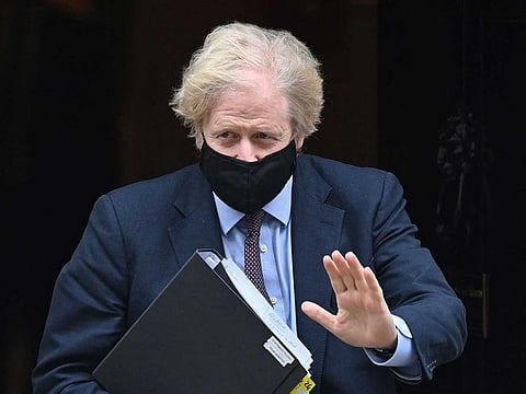 Britain's Prime Minister Boris Johnson leaves 10 Downing street to deliver a statement to Parliament on the government's Integrated Review in London on March 16, 2021. 