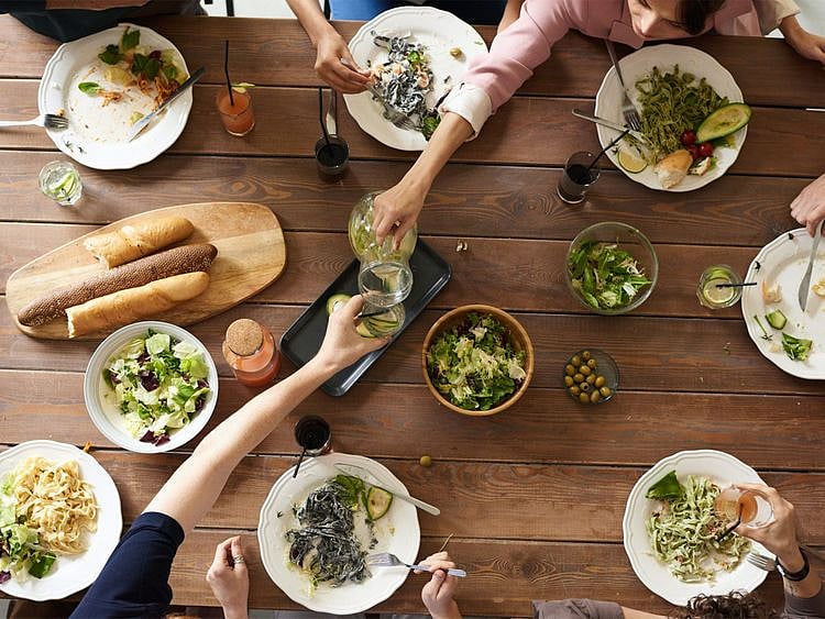 Hosting dinner table food group guest