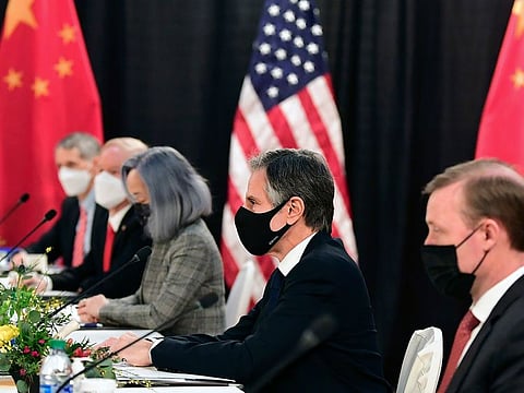 Secretary of State Antony Blinken, second from right, joined by national security adviser Jake Sullivan, right, listen at the opening session of US-China talks at the Captain Cook Hotel in Anchorage, Alaska, Thursday, March 18, 2021.