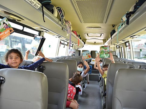 The Aquila School  has 14 buses plying for students and has stocked 50 to 75 books in each bus.