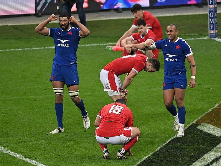 France lock Swan Rebbadj (L) and centre Gael Fickou (R) celebrate after scoring the winning try during the Six Nations clash against Wales