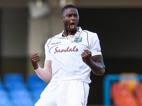 Jason Holder of the West Indies celebrates the dismissal of Lasith Embuldeniya of Sri Lanka.