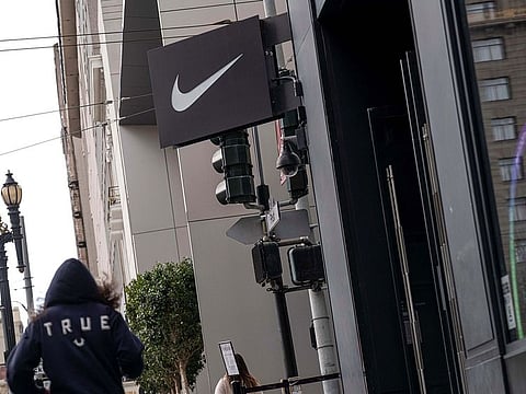 A pedestrian walks in front of a Nike Inc. store in San Francisco on March 15, 2021. 