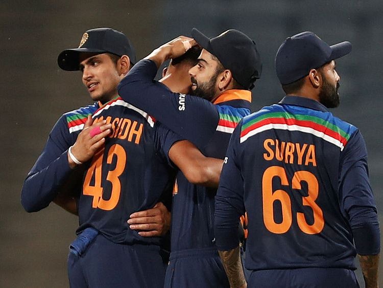  India's Prasidh Krishna celebrates with skipper Virat Kohli after taking the wicket of England's Tom Curran 