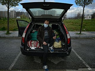 Photos: Cars become home for Spain's COVID-19 pandemic casualties 