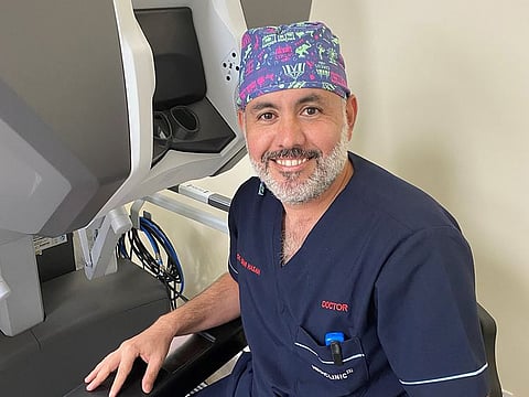 Dr Mudhar Hasan, Consultant Urologist and Robotic Surgeon at Mediclinic City Hospital, gets ready to operate seated in front of Da Vinci Xi's surgeon console