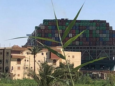 Stranded container ship Ever Given, one of the world's largest container ships, is seen after it ran aground, in Suez Canal, Egypt.