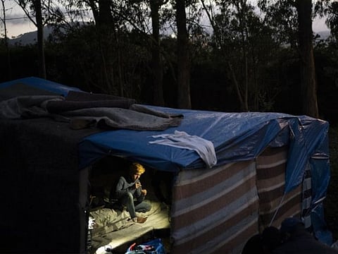A migrant rests in Las Raices camp in San Cristobal de la Laguna, in the Canary Island of Tenerife, Spain.