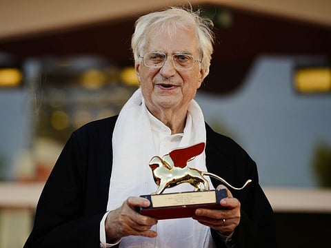 In this Sept. 8, 2015, file photo, director Bertrand Tavernier poses with his Golden Lion for Lifetime Achievements after the award ceremony at the 72nd edition of the Venice Film Festival in Venice, Italy.