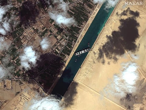 This satellite image from Maxar Technologies shows the cargo ship MV Ever Given stuck in the Suez Canal near Suez, Egypt, Saturday, March 27, 2021.  