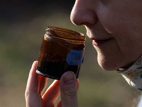 Leah Holzel, 60, food editor, smells aromatic spices in New York City. Holzel, who had lost her sense of smell from 2016 to 2019, now coaches people who have lost their sense of smell due to COVID-19 and has helped six people recover from anosmia since the start of the pandemic. 