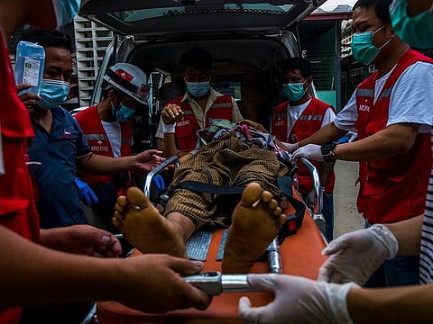 A protester injured during a clash with security forces arrives at a hospital in Yangon, Myanmar, March 28, 2021.