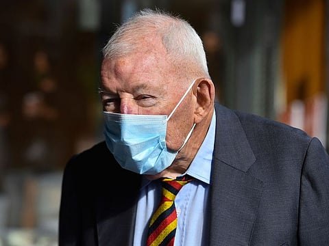 Ron Brierley leaves the Downing Centre District Court in Sydney, Thursday, April 1, 2021. Brierley, one of New Zealand's most well-known businessmen, pleaded guilty Thursday to possessing child sex abuse images, including some of children as young as 2. 