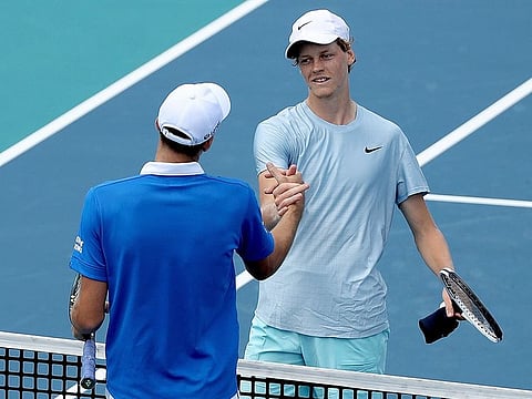Hubert Hurkacz of Poland is congratulated by Jannik Sinner after the Miami Open final