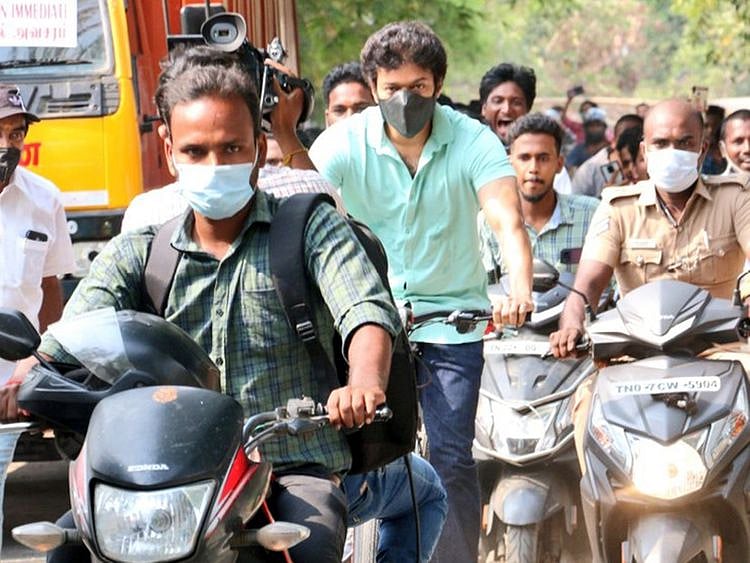 Indian actor Vijay riding a bicycle to a polling booth in Chennai