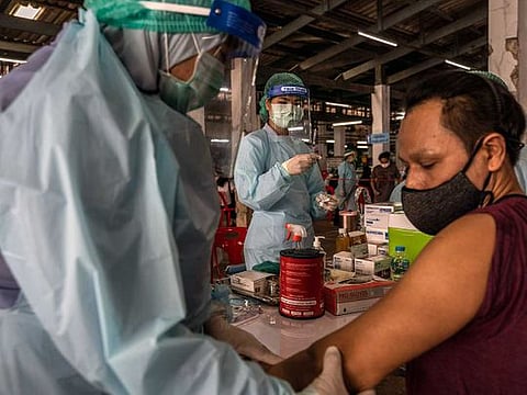 A man receives a COVID-19 vaccine during a vaccination drive in Bangkok, Thailand, on March 17, 2021. Countries struggling to obtain vaccines from wealthier countries may be able to make NVD-HXP-S for themselves or acquire it at low cost from neighbours. 