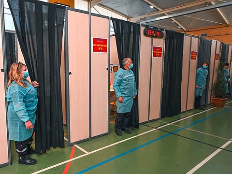 Firefighters prepare to vaccinate members of the public at the SDIS34 fire station transformed into a temporary vaccination centre, in Vailhauques, near Montpellier in the south of France, on April 8, 2021, as part of france's vaccination campaign aimed at curbing the spread of the COVID-19 pandemic. 
