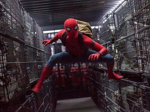 This image released by Columbia Pictures shows Tom Holland in a scene from "Spider-Man: Homecoming." Netflix scored a multi-year deal that will make it the new streaming home to Sony Pictures’ top releases in the U.S. Beginning next year, Sony’s new films will stream domestically on Netflix after their theatrical runs. That includes movies in popular franchises like “Spider-Man,” “Venom” and “Jumanji.”