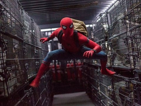 This image released by Columbia Pictures shows Tom Holland in a scene from "Spider-Man: Homecoming." Netflix scored a multi-year deal that will make it the new streaming home to Sony Pictures’ top releases in the U.S. Beginning next year, Sony’s new films will stream domestically on Netflix after their theatrical runs. That includes movies in popular franchises like “Spider-Man,” “Venom” and “Jumanji.”