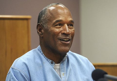 In this July 20, 2017, file photo, former NFL football star OJ Simpson appears via video for his parole hearing at the Lovelock Correctional Center in Lovelock, Nev.