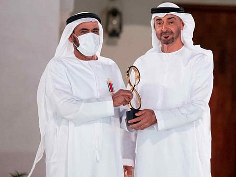 His Highness Sheikh Mohamed bin Zayed Al Nahyan, Crown Prince of Abu Dhabi and Deputy Supreme Commander of the UAE Armed Forces, with Lt. Gen. (retired) Obaid bin Mohammed Al Kaabi who was honoured at the 10th Abu Dhabi Awards for his outstanding contributions to military and community service.