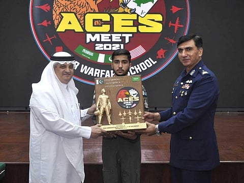 Base Commander PAF Base Mushaf Air Commodore Ali Naeem Zahoor (right) presenting souvenir to Saudi ambassador to Pakistan Nawaf bin Saeed Al Maliki (left) at PAF operational base on April 8, 2021. 