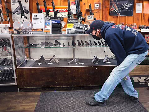 Alexander Carey shops for a new handgun at Freddie Bear Sports on April 08, 2021 in Tinley Park, Illinois. President Joe Biden announced gun control measures which included stricter controls on the purchase of homemade firearms, commonly referred to as Ghost Guns and he made a push for national Red Flag legislation and other measures. 